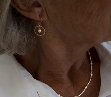 Gold pearl and slim circle pearl earrings and gold tube necklace